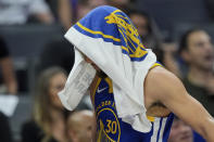 Golden State Warriors guard Stephen Curry walks to the bench during the second half of the team's NBA basketball play-in tournament game against the Sacramento Kings, Tuesday, April 16, 2024, in Sacramento, Calif. (AP Photo/Godofredo A. Vásquez)