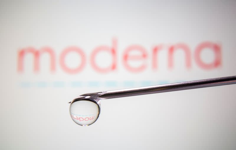 Moderna's logo is reflected in a drop on a syringe needle in this illustration