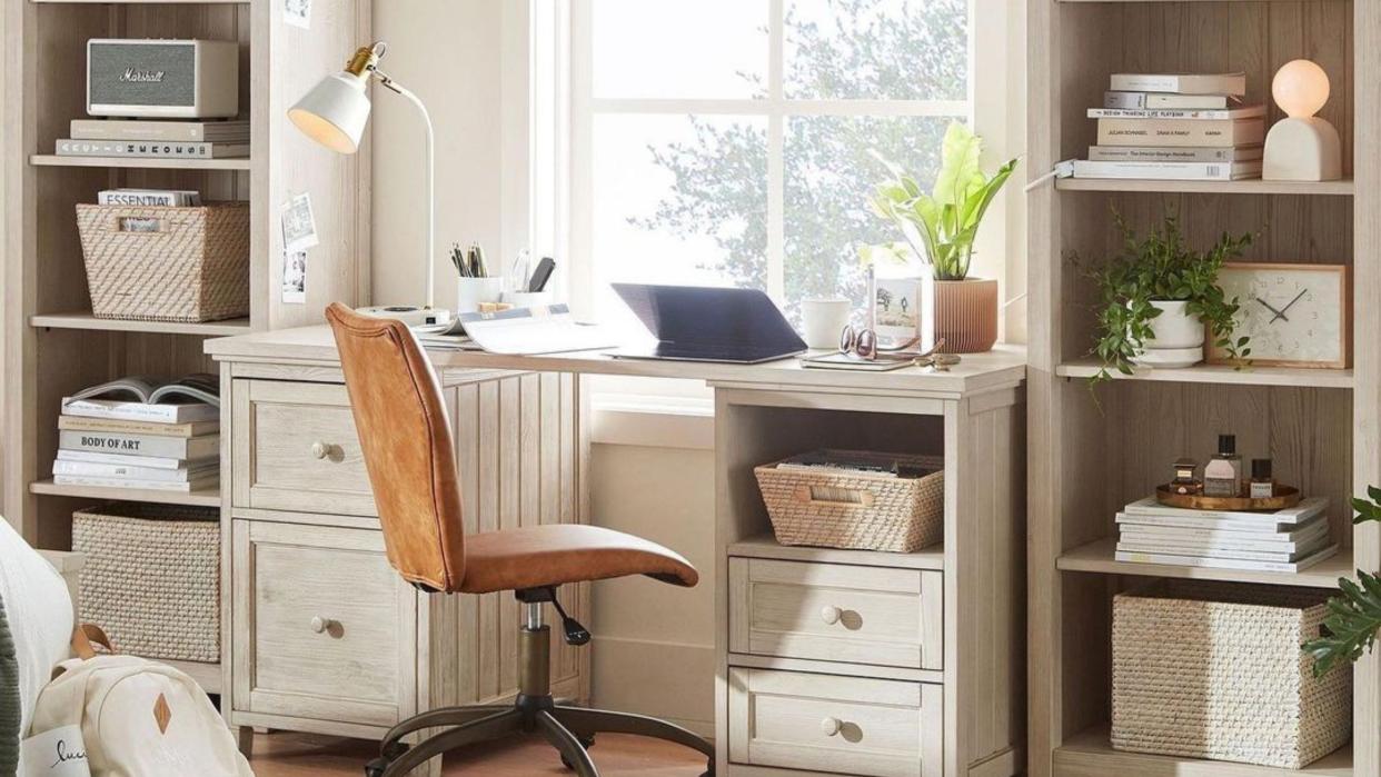  Leather desk chair in neutral office. 