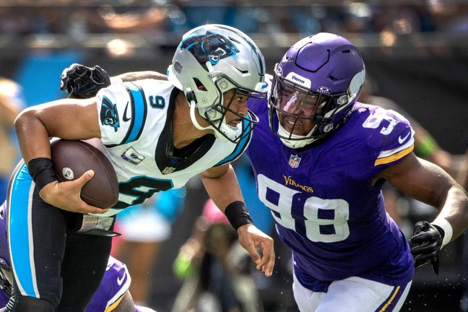 Oct 1, 2023; Charlotte, North Carolina, USA; Minnesota Vikings linebacker D.J. Wonnum (98) sacks Carolina Panthers quarterback Bryce Young (9) in the third quarter at Bank of America Stadium. Mandatory Credit: Bob Donnan-USA TODAY Sports