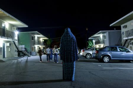 Syrian refugee Dania poses for a portrait at the Sacramento, California apartment complex she lives in, November 16, 2015. REUTERS/Max Whittaker