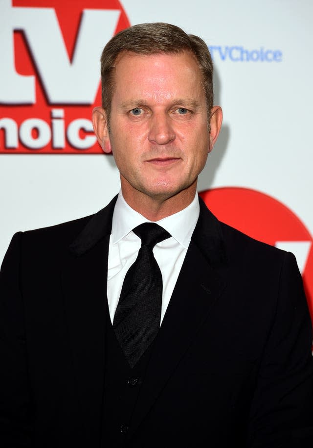 Jeremy Kyle in a black suit on a red carpet