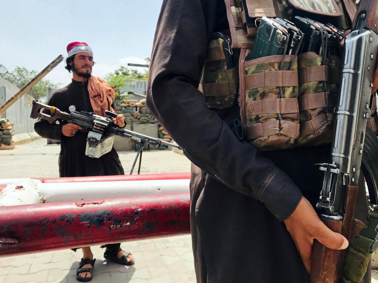 Taliban soldiers with guns.