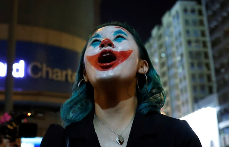 Anti-government protesters wearing costumes march during Halloween in Hong Kong