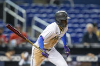 Miami Marlins second baseman Jazz Chisholm Jr. (2) runs to first base during the fifth inning of a baseball game against the Washington Nationals on Thursday, June 24, 2021, in Miami. (AP Photo/Mary Holt)