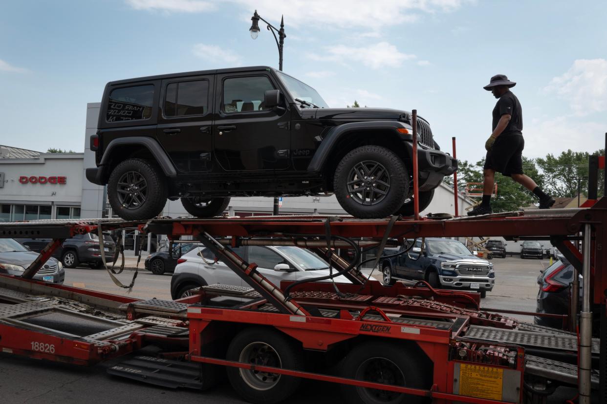 Jeep vehicles are delivered to a dealership on June 20, 2024 in Chicago, Illinois. A cyber attack on CDK Global, a software provider that helps dealerships manage sales and service, has crippled the workflow at approximately 15,000 dealerships across the United States and Canada.