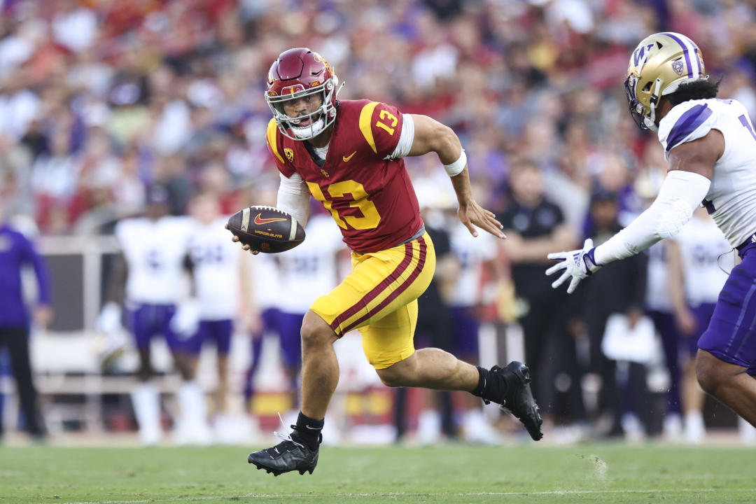 November 4, 2023. Los Angeles, California, USA. USC Trojans quarterback Caleb Williams, 13, runs with the ball during the first quarter of a game against the Washington Huskies at United Airlines Field at the Los Angeles Memorial Coliseum. Required Credit: Jessica Alcheh-USA TODAY Sports