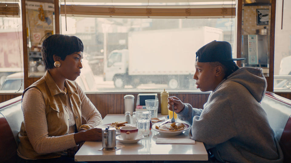 Angela Bassett and Lena Waithe sit across from each other at a diner