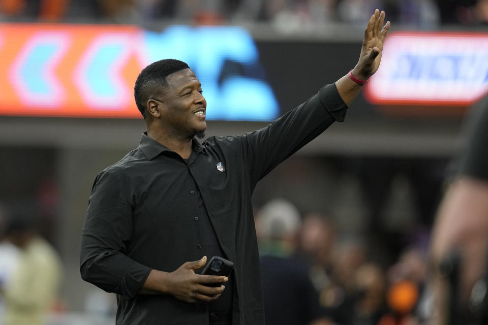 FILE - LeRoy Butler III waves while being honored for the Pro Football Hall of Fame during the first half of the NFL Super Bowl 56 football game between the Los Angeles Rams and the Cincinnati Bengals, Sunday, Feb. 13, 2022, in Inglewood, Calif. After starring for the Seminoles, Butler helped recast the safety position in the NFL and restore Green Bay's glory days during a 12-year career that featured five All-Pro selections and landed him in the Pro Football Hall of Fame's Class of 2022. (AP Photo/Marcio Jose Sanchez, File)