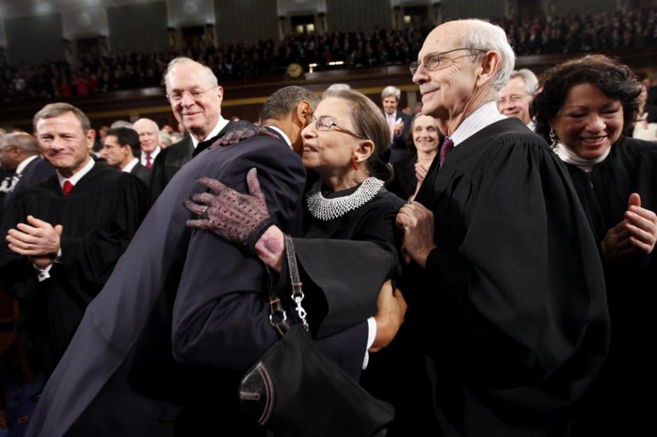 President Barack Obama hugs Supreme Court Justice Ruth Bader Ginsburg on Capitol Hill in Washington. Source: AP