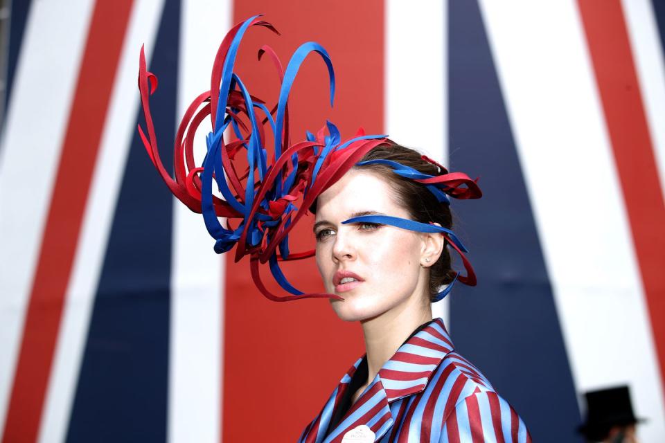 <p>Marina Zubkova donned an avant-garde blue and red firework headpiece. </p>