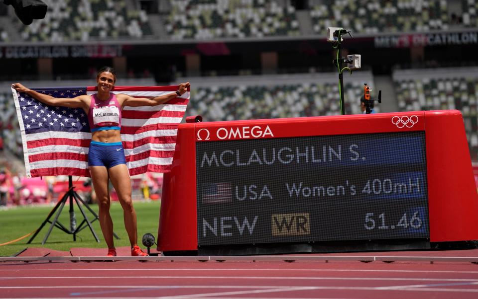 Gold medalist Sydney McLaughlin alongside her world record time - AP