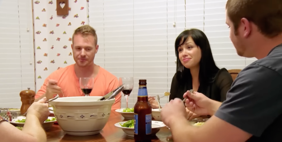 Russ and Paola Mayfield at the dinner table on 90 Day Fiancé Season 1