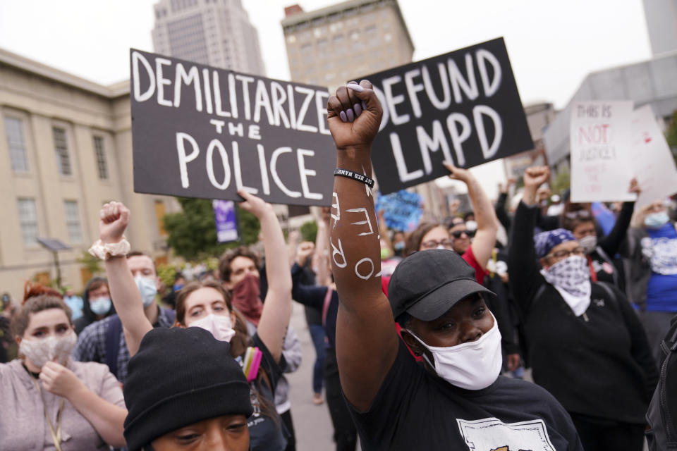 FILE - In this Sept. 23, 2020, file photo, protesters speak in Louisville, Ky. Hours of material in the grand jury proceedings for Taylor’s fatal shooting by police have been made public on Friday, Oct. 2. (AP Photo/John Minchillo, File)