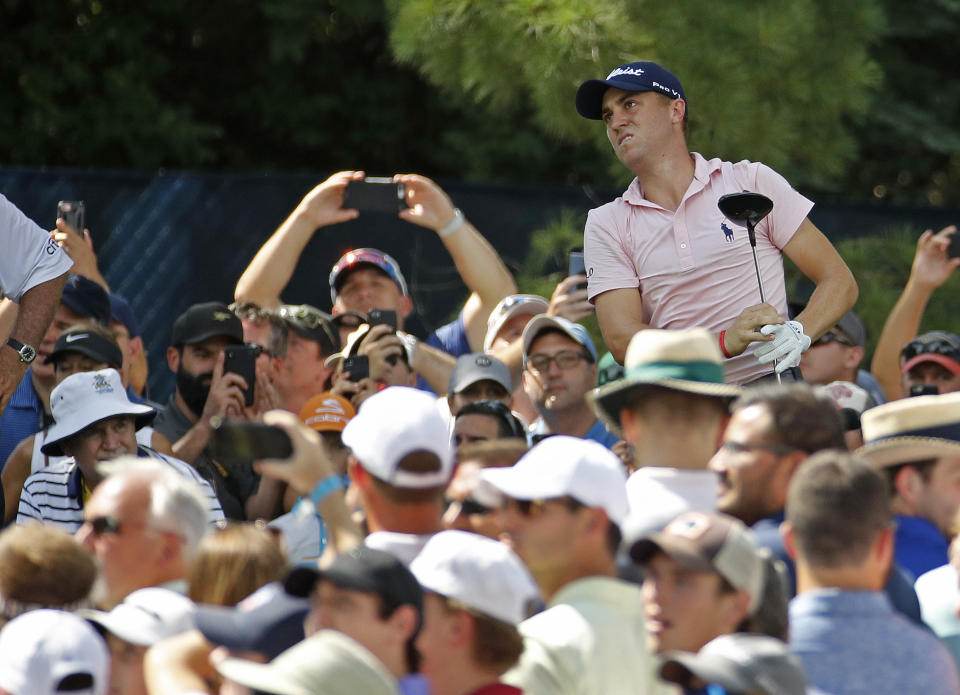 Justin Thomas watches his tee shot on the 15th hole during a practice round for the PGA Championship golf tournament at Bellerive Country Club, Wednesday, Aug. 8, 2018, in St. Louis. (AP Photo/Charlie Riedel)