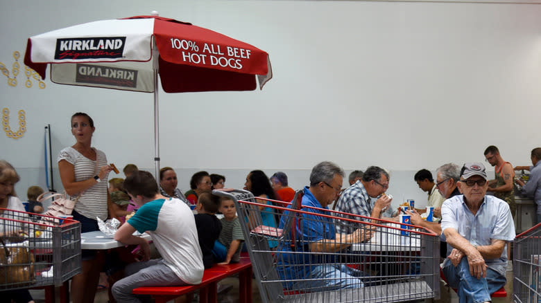 customers eating at Costco tables  