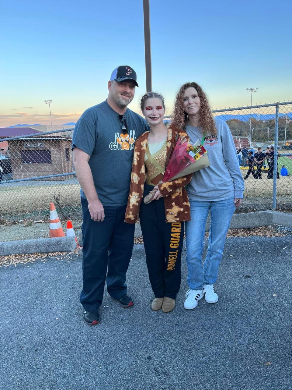 Hailey Whitehouse (center), with her parents, Robert and Tracy Bell, will have a busy summer on the Drum Corps International circuit.