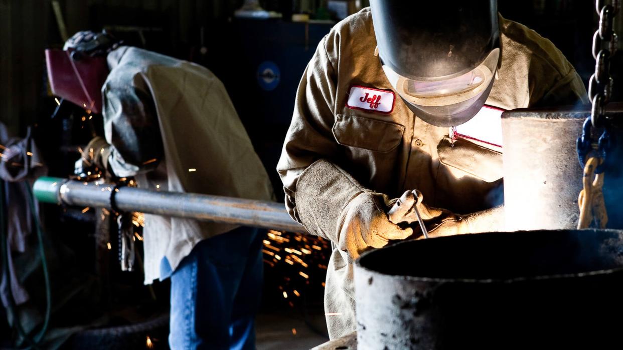 Welders with steel.