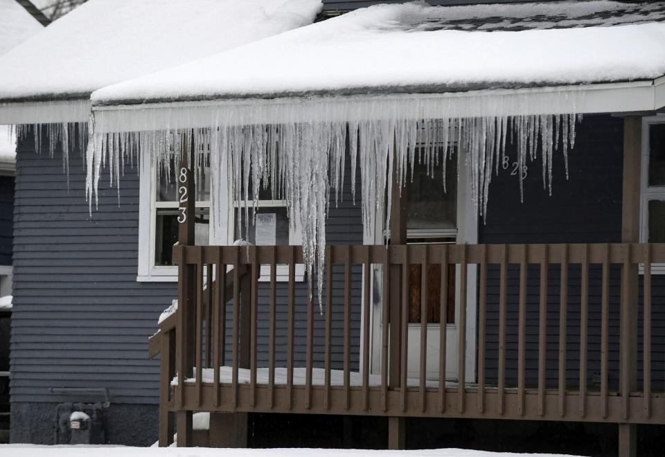 Rain from a winter storm creates icy conditions  on Dec.13, 2022, in Sioux Falls, S.D.