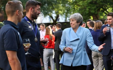 Britain's Prime Minister Theresa May with Liam Plunkett and Tom Curran  - Credit: Yui Mok/PA