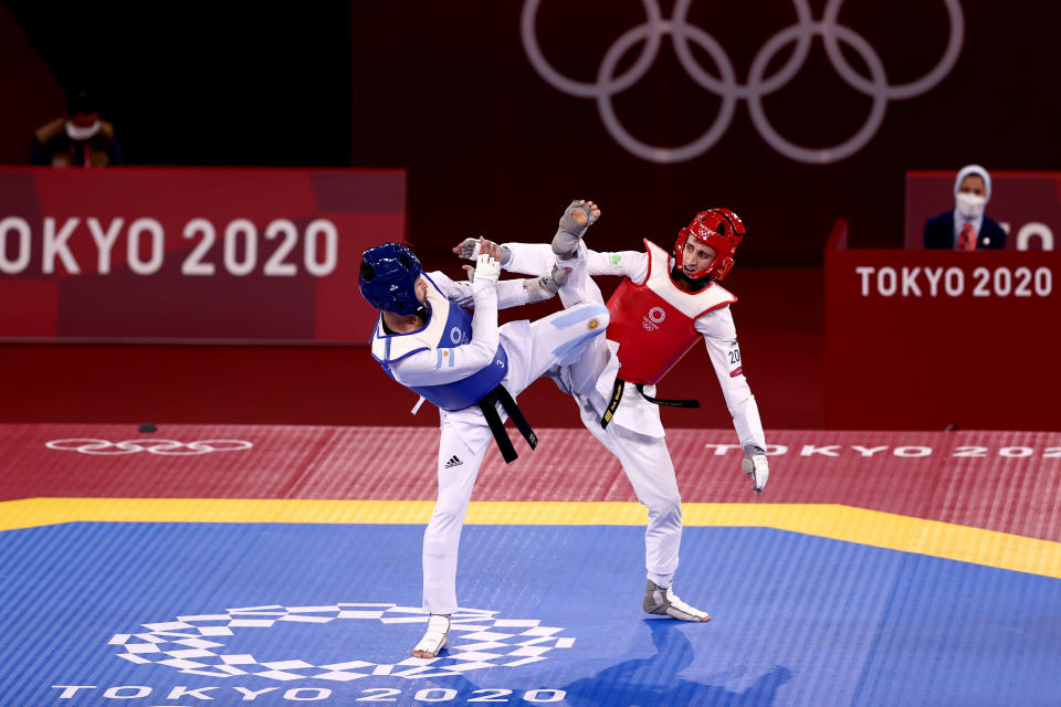 CHIBA, JAPAN - JULY 24: Lucas Lautaro Guzman (L) of Team Argentina competes against Jack Woolley of Team Ireland  during the Men's -58kg Taekwondo Round of 16 contest on day one of the Tokyo 2020 Olympic Games at Makuhari Messe Hall on July 24, 2021 in Chiba, Japan. (Photo by Maja Hitij/Getty Images