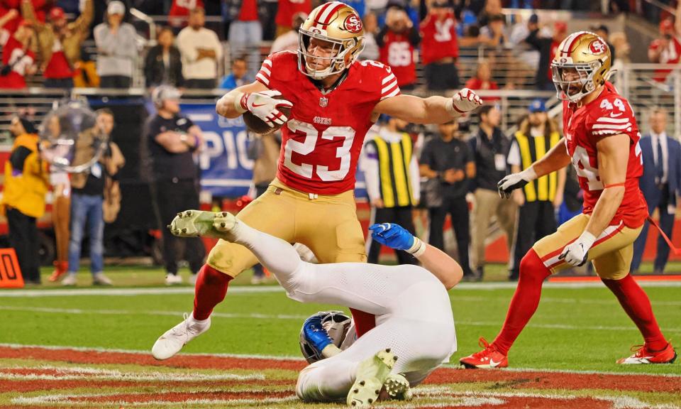 <span>Christian McCaffrey’s threat as a rusher helps the San Francisco 49ers’ passing game.</span><span>Photograph: Kelley L Cox/USA Today Sports</span>