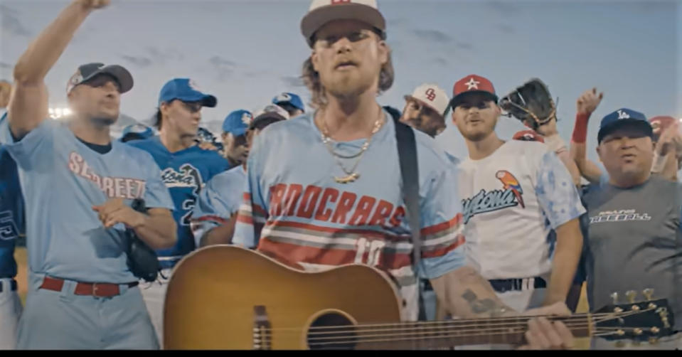 Brian Kelley, with guitar, is joined by members of the Seabreeze High and Daytona State College baseball teams in a scene from "Florida Boy Forever" music video. The country star known for his work in Florida Georgia Line returns to Daytona Beach for a May 26 concert at the Daytona Beach Bandshell.