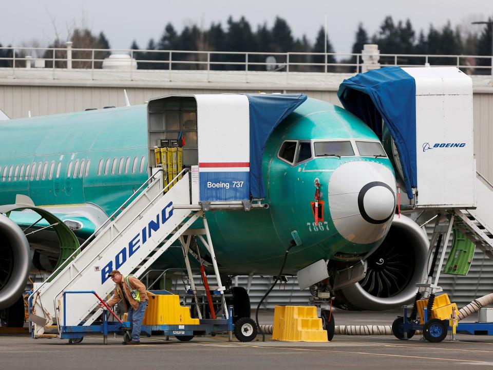 FILE PHOTO: An employee works near a Boeing 737 Max aircraft at Boeing's 737 Max production facility in Renton, Washington, U.S. December 16, 2019. REUTERS/Lindsey Wasson