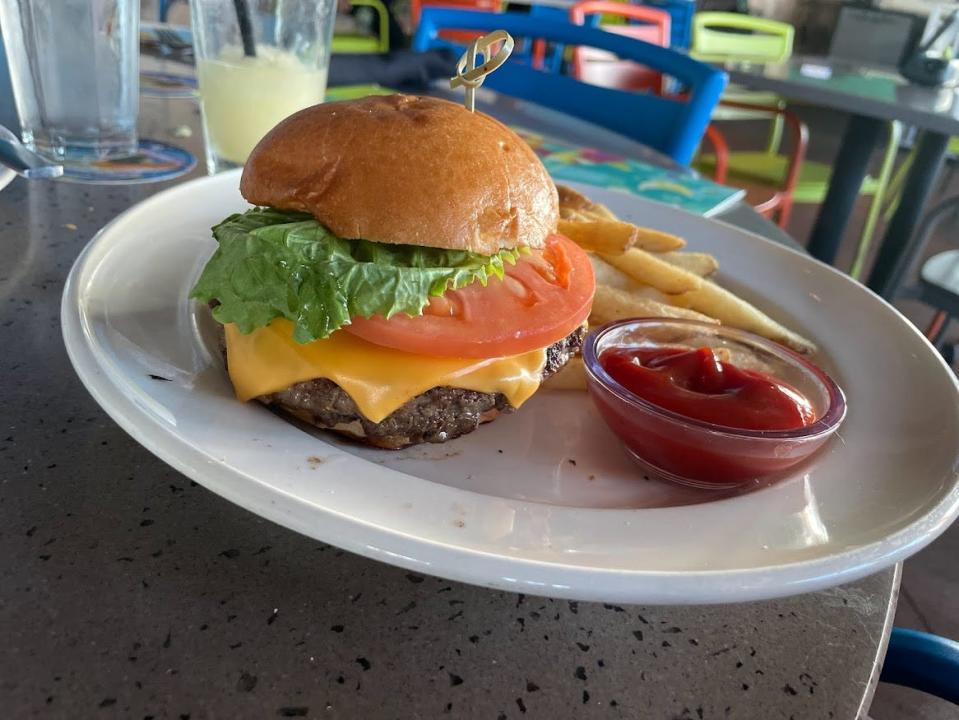 Burger with tomato, lettuce, cheese at Bahama Breeze
