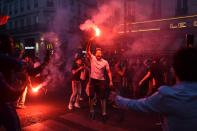 <p>People celebrate France’s victory in central Paris on July 10, 2018 after the final whistle of the Russia 2018 World Cup semi-final football match between France and Belgium. (Photo by Lucas BARIOULET / AFP) </p>