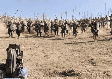 medieval soldiers storm down a hill in "babylon"
