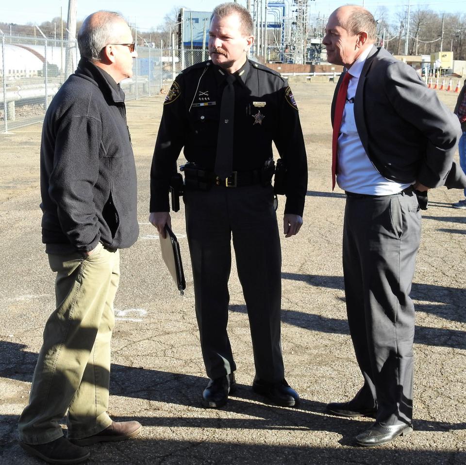 Commissioner Gary Fischer, Sheriff James Crawford and former State Sen. Jay Hottinger talk prior to a groundbreaking ceremony last December for the new Coshocton Justice Center. The construction project is one of many happening in Coshocton now showing expansion.