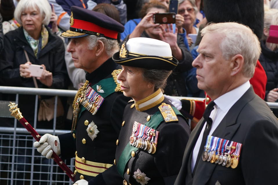 <p>King Charles III, Princess Anne and Prince Andrew join the procession of Queen Elizabeth II's coffin from the Palace of Holyroodhouse to St Giles' Cathedral, in Edinburgh, Monday, Sept. 12, 2022. King Charles arrived in Edinburgh on Monday to accompany his late mother’s coffin on an emotion-charged procession through the historic heart of the Scottish capital to the cathedral where it will lie for 24 hours to allow the public to pay their last respects. (Andrew Milligan/Pool Photo via AP)</p> 