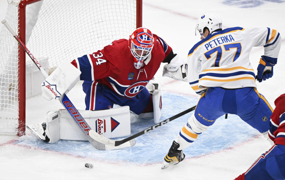 Montreal Canadiens goaltender Jake Allen stops Buffalo Sabres' JJ Peterka during the second period of an NHL hockey game Thursday, Jan. 4, 2024, in Montreal. (Graham Hughes/The Canadian Press via AP)