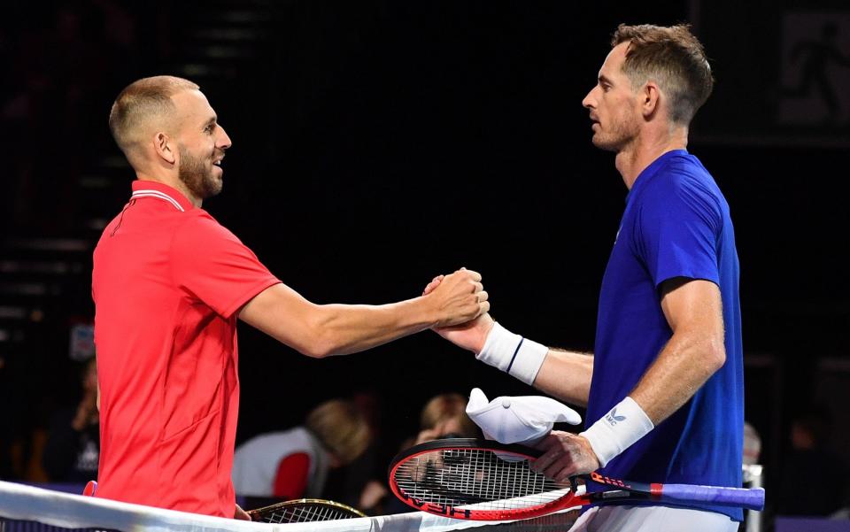 Dan Evans of England shakes hands with Andy MurrayÂ of Scotland after winning their match during day two of the Battle of the Brits at P&J Live Arena on December 22, 2022 - Mark Runnacles/Getty Images