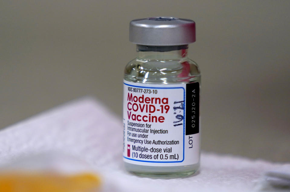 FILE - In this file photo dated Wednesday, Dec. 30, 2020, a bottle of Moderna COVID-19 vaccine on a table before being utilised in Topeka, USA. Britain has authorized a coronavirus vaccine developed by Moderna, the third to be licensed for use in the country. The Department of Health said Friday, Jan. 8, 2021 that the vaccine meets the regulator’s “strict standards of safety, efficacy and quality.” Britain has ordered 10 million doses of the vaccine, though it is not expected to be delivered to the U.K. until spring. So far Britain has inoculated 1,5 million people with two other vaccines. (AP Photo/Charlie Riedel, File)