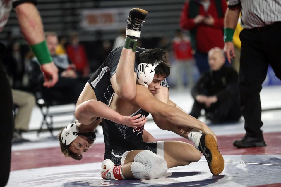 South Kitsap’s Mitchell Neiner wrestles Skyview’s Owen Pritchard for their 138-pound championship bout during Mat Classic Championships at the Tacoma Dome on Saturday, Feb. 18, 2023. 