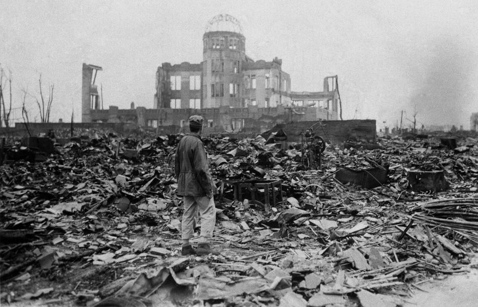 Image: A correspondent stands in the rubble in Hiroshima on Sept. 8, 1945, a month after the first atomic bomb ever used in warfare was dropped by the U.S. (Stanley Troutman / AP)