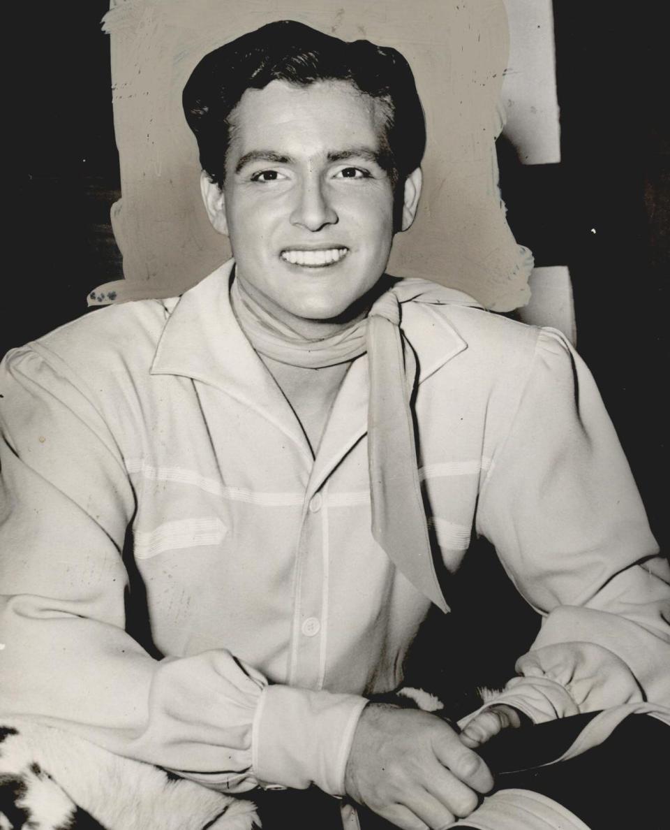 Oklahoma native and Choctaw tribal member Ridge Bond, who is best remembered for playing the role of Curly in the musical "Oklahoma!" on Broadway and on tour, smiles in a February 15, 1948, photograph. Bond's 1953 performance of the musical's theme on the floor of the state House of Representatives persuaded state legislators to vote for "Oklahoma" as the new official state song.