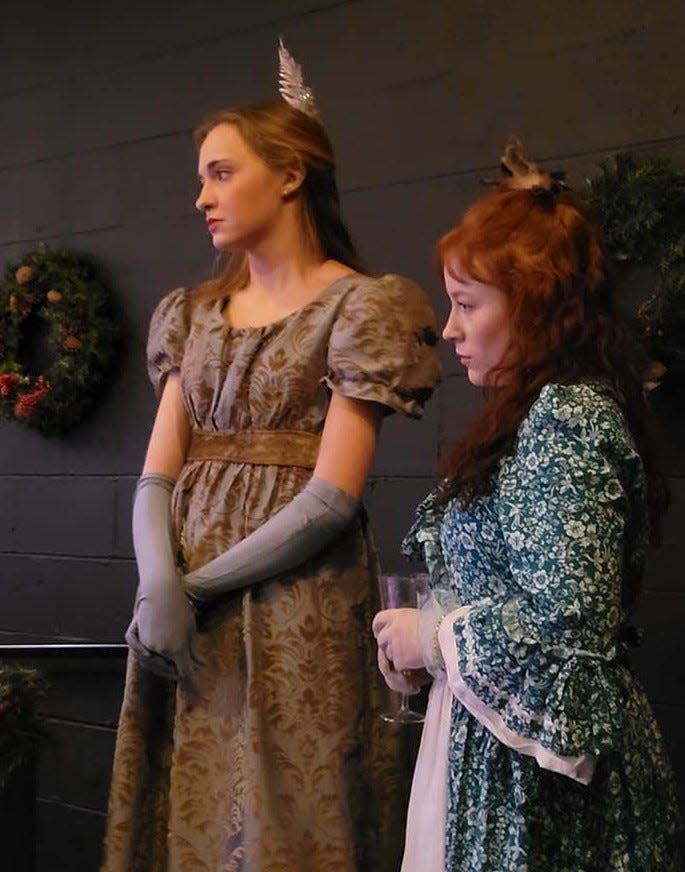 From left, Elizabeth Bennet (Olivia Akers) from the Jane Austen novel "Pride and Prejudice" and Anne Elliot (Jacey Nichole) from Austen's book "Persuasion," watch an emotional scene play out involving the Dashwood sisters from "Sense and Sensibility" at the Dec. 10 performance of Oklahoma Shakespeare in the Park's original interactive holiday show "Jane Austen's Christmas Cracker" in Oklahoma City's Paseo Arts District.