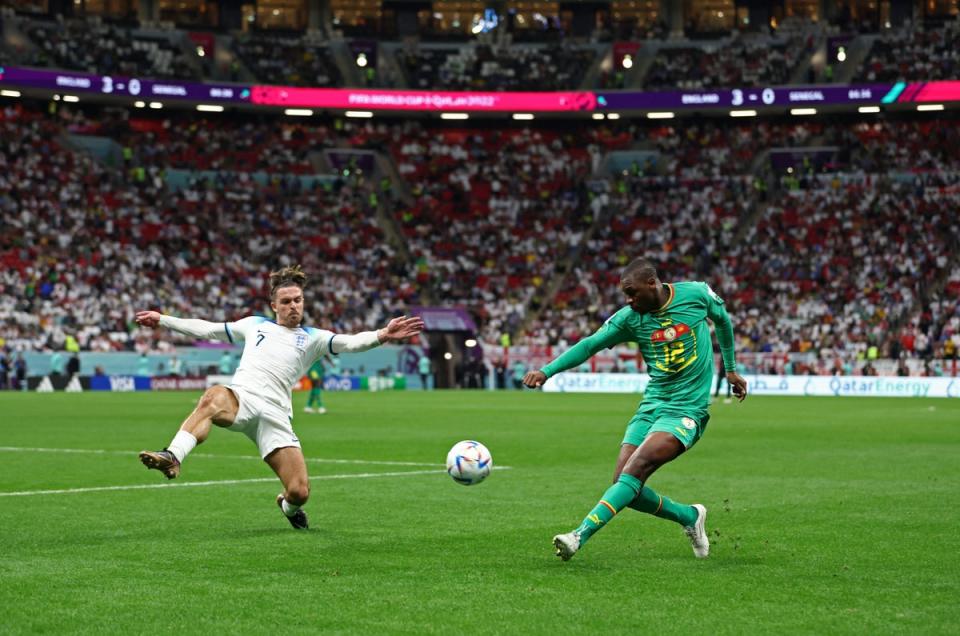 Jack Grealish faces off against Senegal’s Fode Ballo-Toure (Reuters)