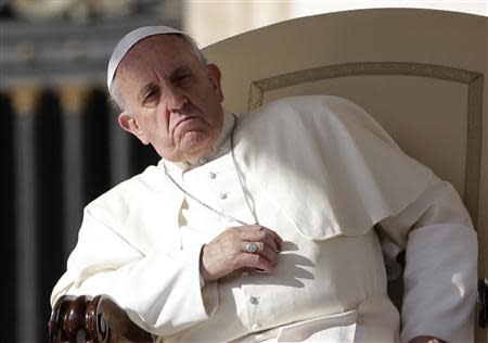 Pope Francis looks on during his Wednesday general audience in Saint Peter's square at the Vatican October 23, 2013. REUTERS/Max Rossi