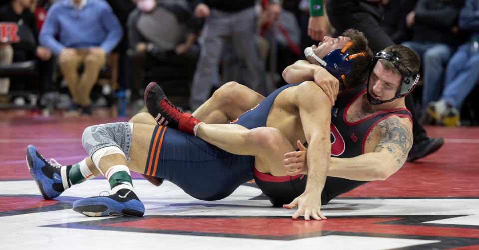 Rutgers' 197-pounder Greg Bulsak tries to put Illinois' Matt Wroblewski to his back during his 9-1 win Friday night that enabled him to remain unbeaten. Rutgers won the match 21-13.