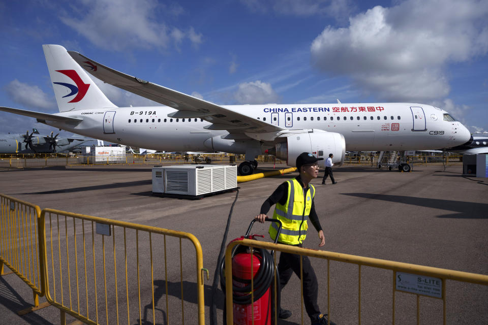 A China's Comac C919 aircraft is displayed during the first day of Singapore Airshow in Singapore, Tuesday, Feb. 20, 2024. The Singapore Airshow, Asia's largest, kicked off Tuesday with an array of aerial displays including some by China's COMAC C919 narrow-body airliner.(AP Photo/Vincent Thian)