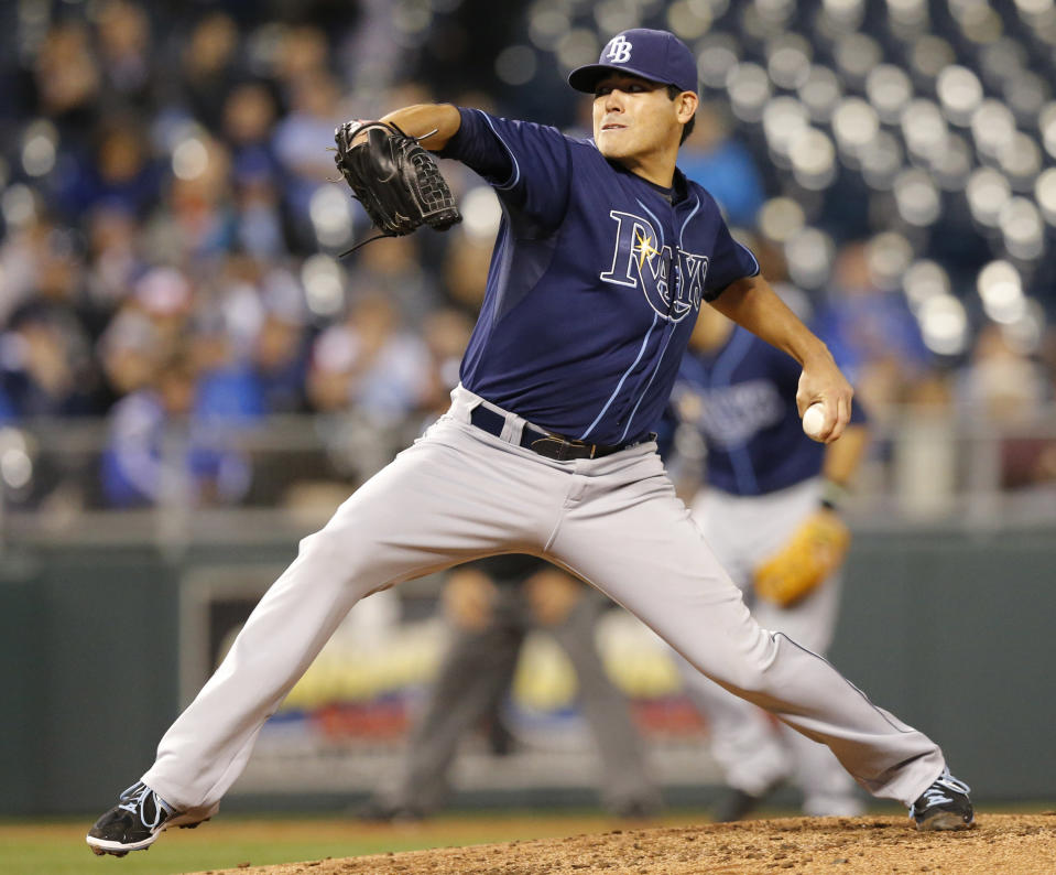 Tampa Bay Rays starting pitcher Matt Moore delivers to a Kansas City Royals batter during the third inning of a baseball game at Kauffman Stadium in Kansas City, Mo., Monday, April 7, 2014. (AP Photo/Orlin Wagner)