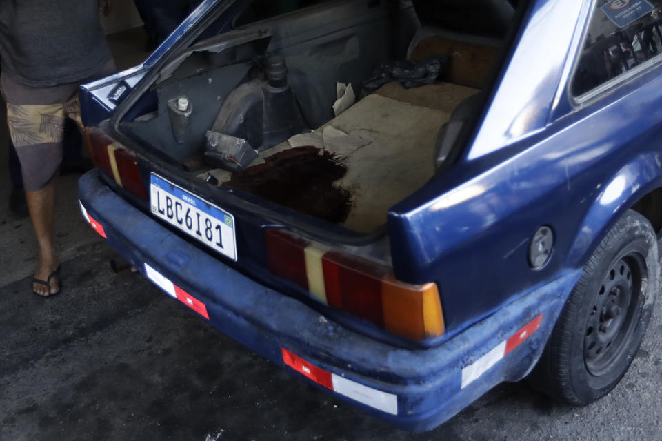 Blood stains the interior of a vehicle used to transport the body of a person killed during a police raid of the Vila Cruzeiro favela, parked outside the Getulio Vargas Hospital in Rio de Janeiro, Brazil, Tuesday, May 24, 2022. Police raided the favela before dawn Tuesday in an operation aimed at locating and arresting criminal leaders, prompting a fierce firefight. (AP Photo/Bruna Prado)