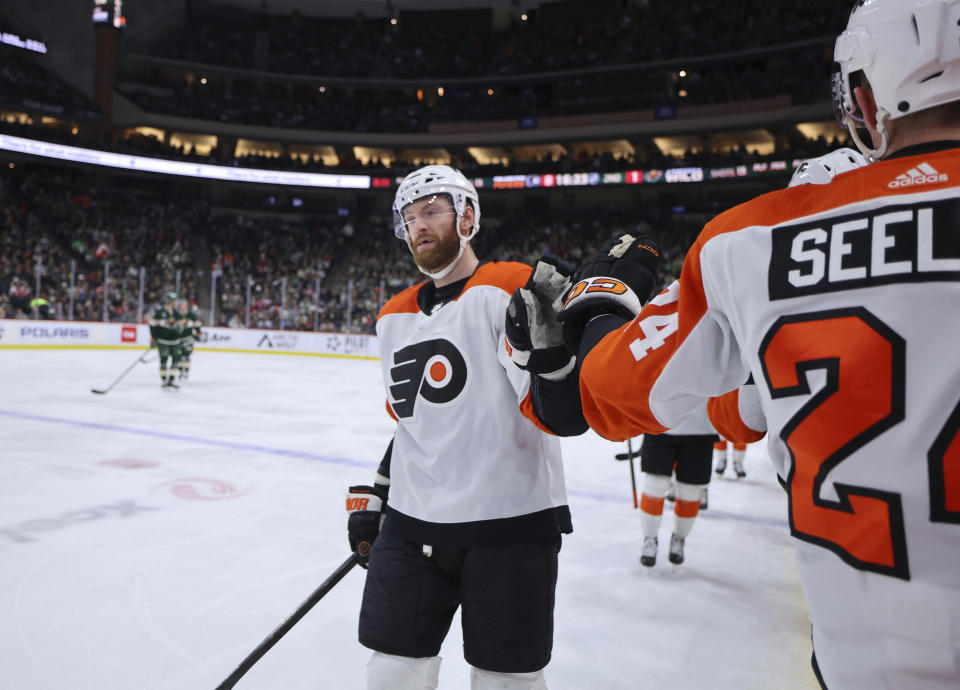 Philadelphia Flyers left wing Joel Farabee celebrates his goal against the Minnesota Wild during the second period of an NHL hockey game Friday, Jan. 12, 2024, in St. Paul, Minn. (AP Photo/Adam Bettcher)