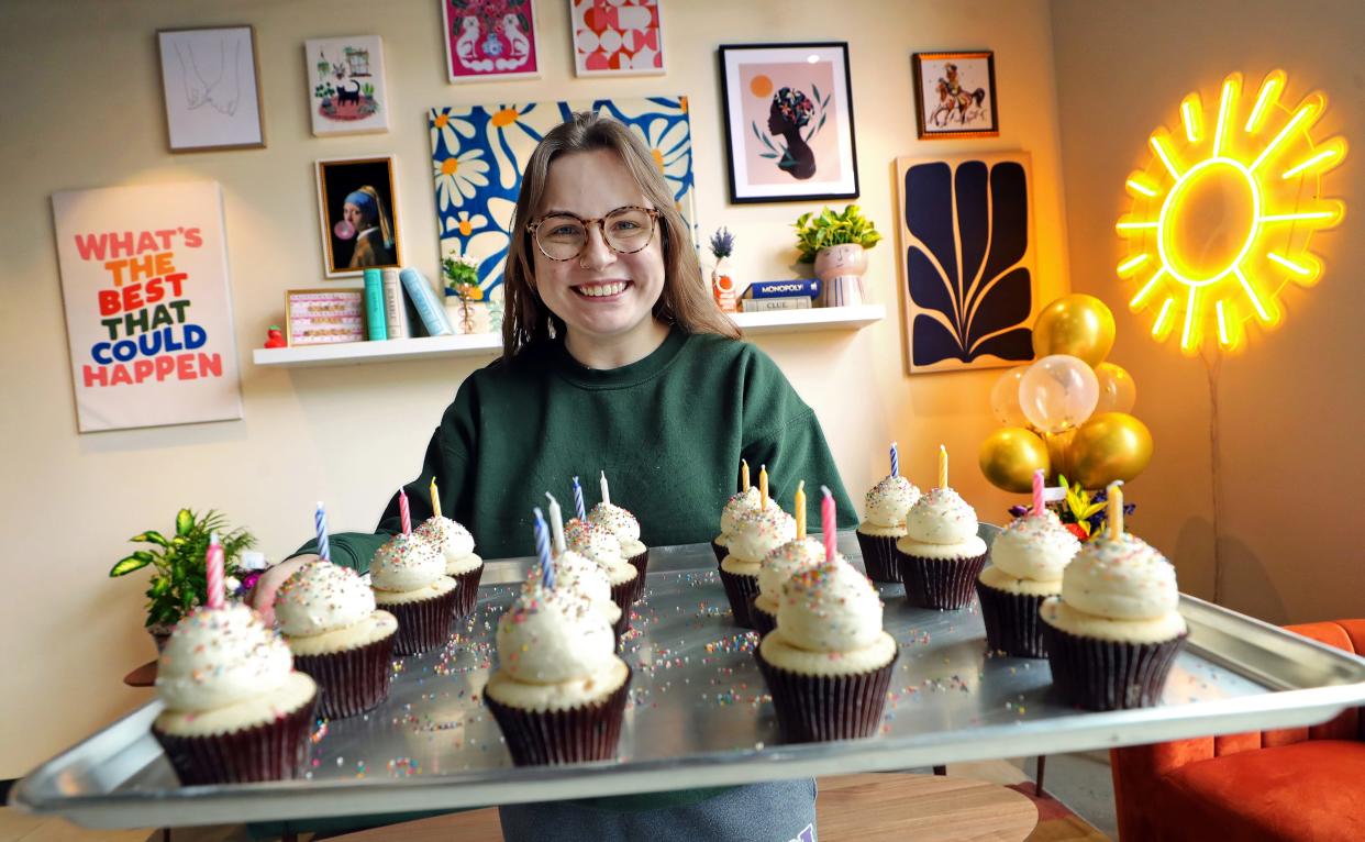 Michela Rocco, owner of Rocco’s Cupcake Cafe in Kent, shows off her birthday cake cupcakes in her new shop on Water Street on Tuesday, Feb. 7, 2023.
