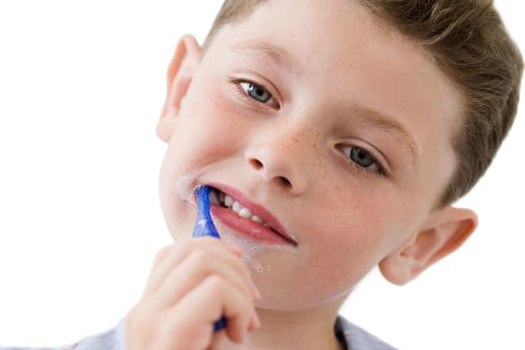 Boy brushing his teeth