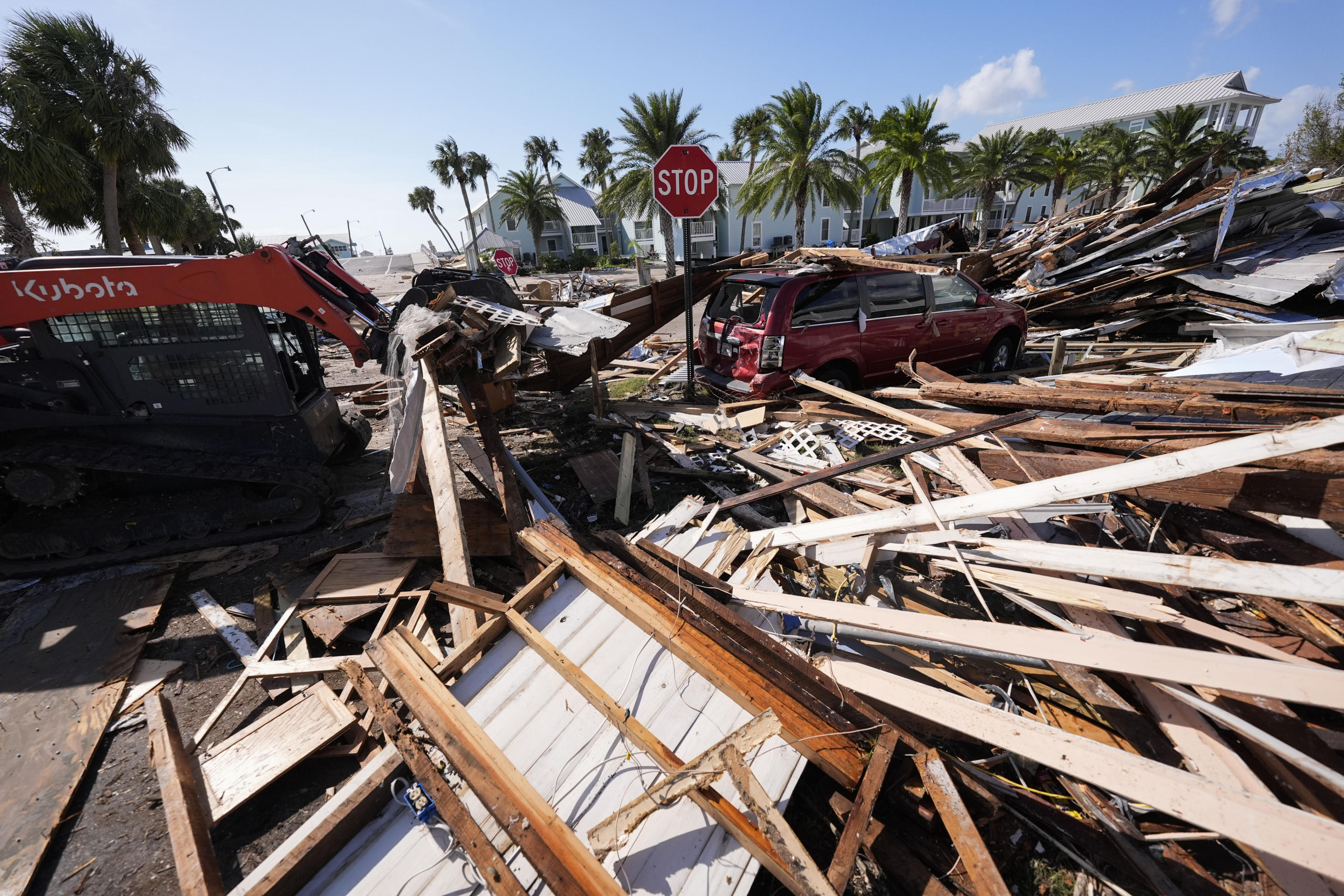 Workers clear debris after Hurricane Helene in Cedar Key, Fla., Friday, Sept. 27, 2024. (Gerald Herbert/AP)